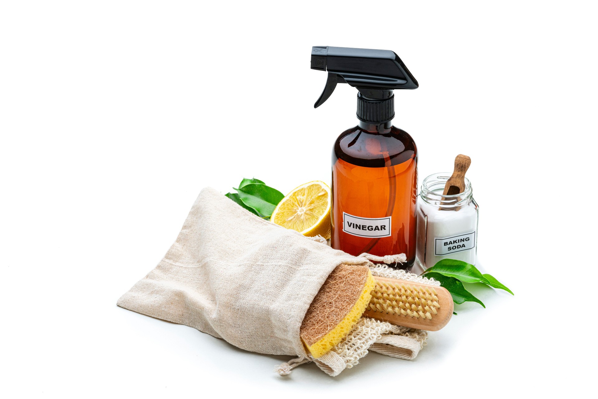 Home cleaning with natural and eco friendly products: Baking soda, white vinegar, lemon and scrubbing brush